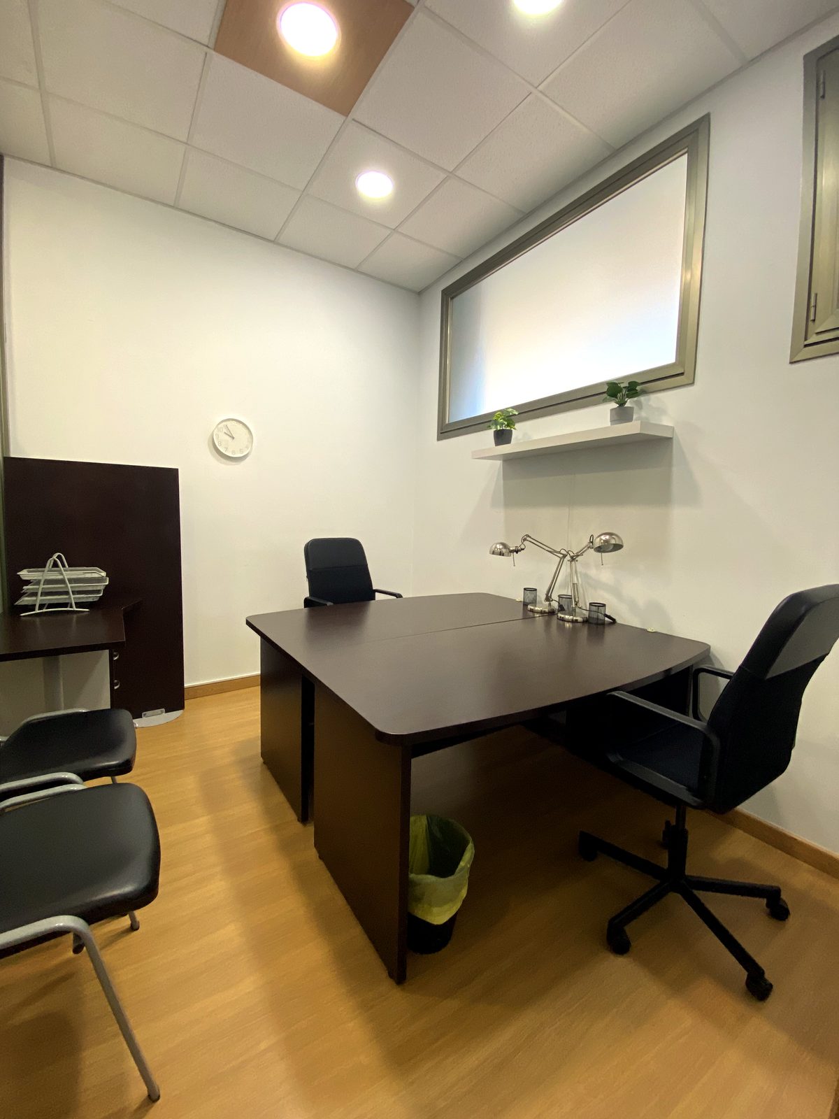 Private office with dark wood desk at Coworking Oleiros
